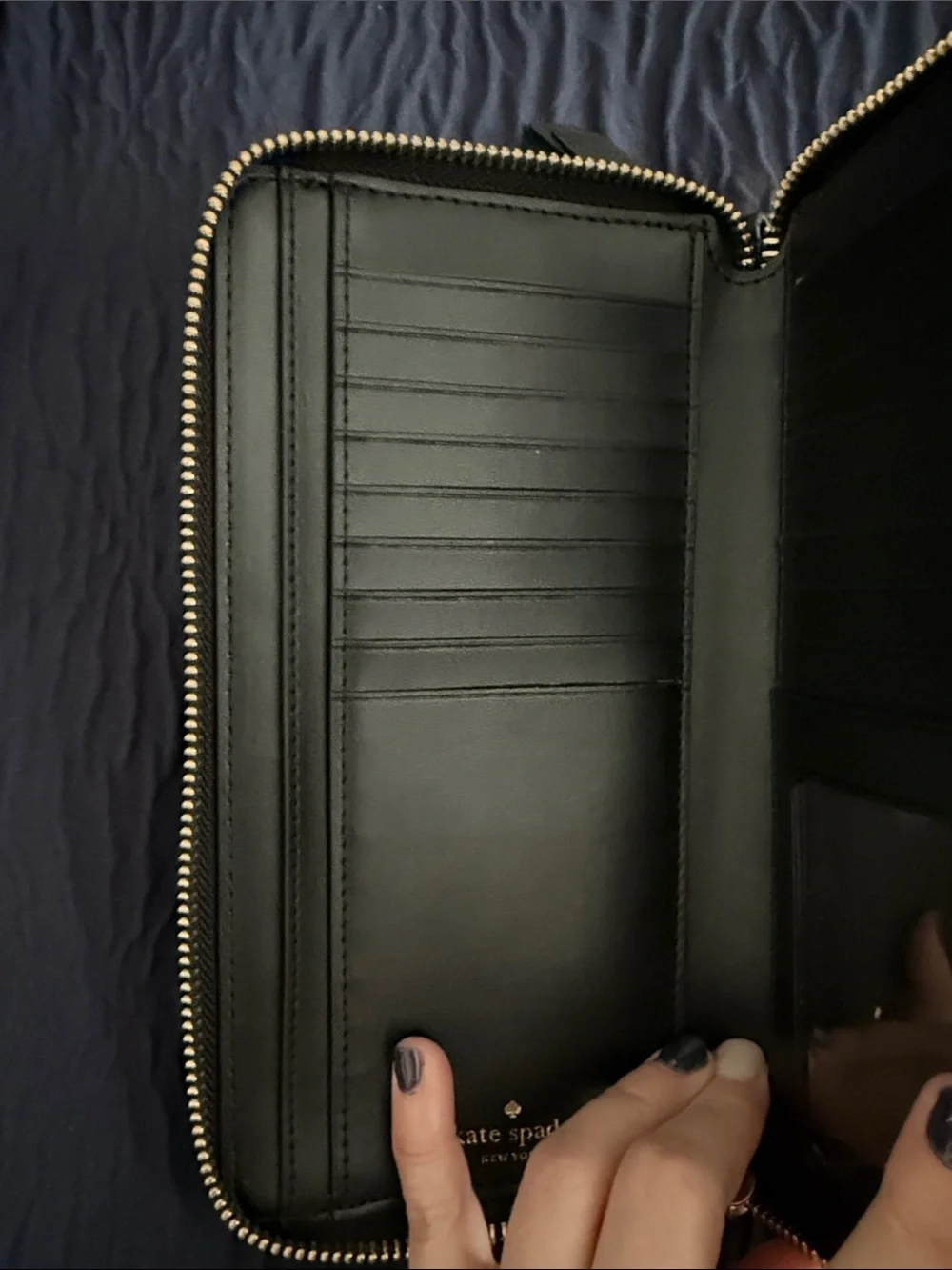 kate spade black pebbled leather wristlet clutch with gold logo